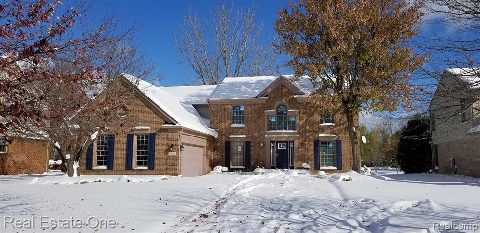 Pulte grand foyer with full brick elevation. Side 