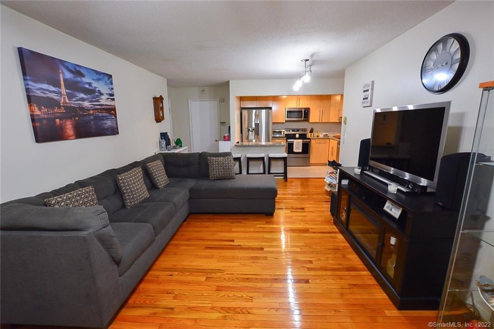 Open floor plan with recently refinished floors.