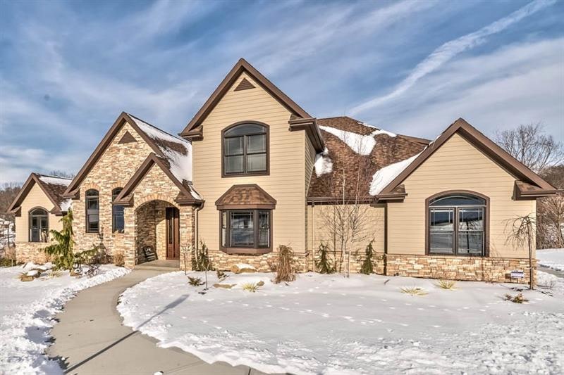Exciting Custom Richey Construction home with ston