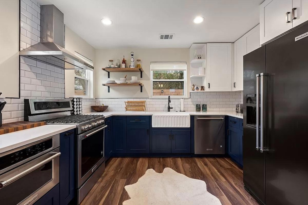 Kitchen featuring appliances with stainless steel