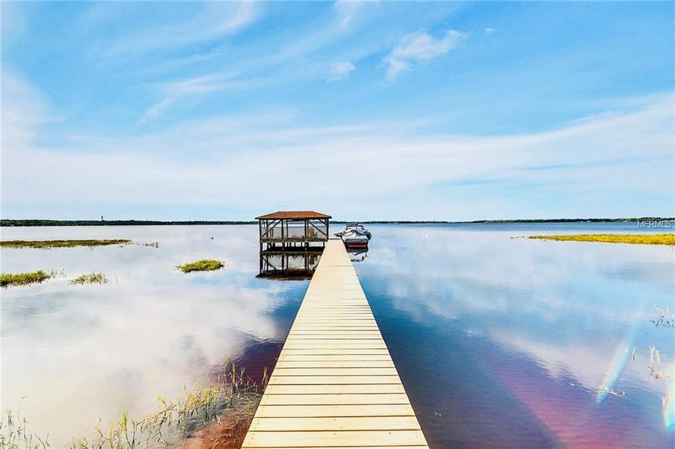 Dock with covered boat slip and deck