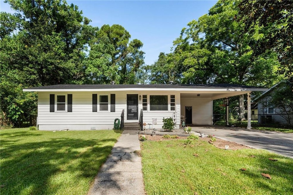 Perfect little house in Saraland with a brand new roof and updated interior, plus covered parking!
