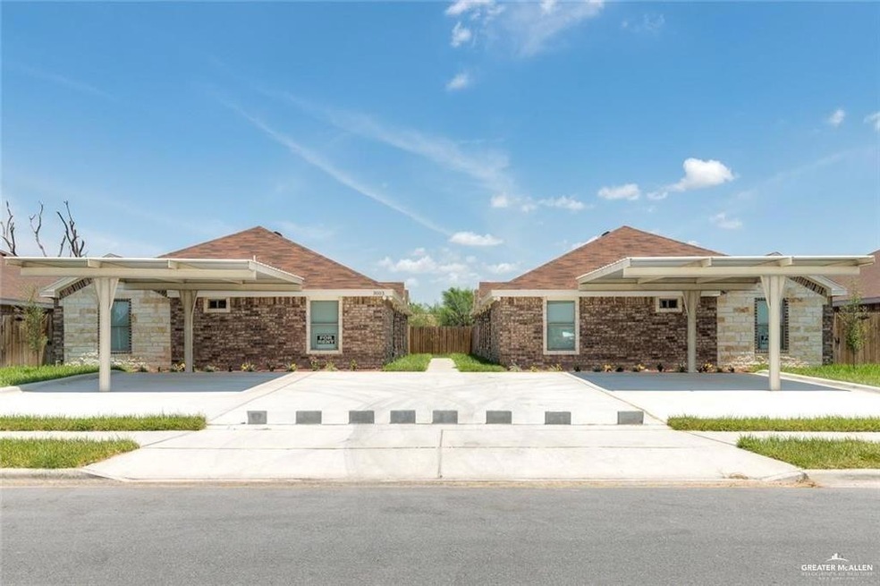 View of home's exterior with stone siding and fence