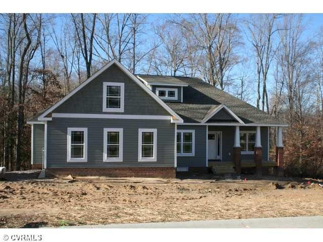 Exterior Front - THIS EXPANDED RANCH WITH CRAFTSMA