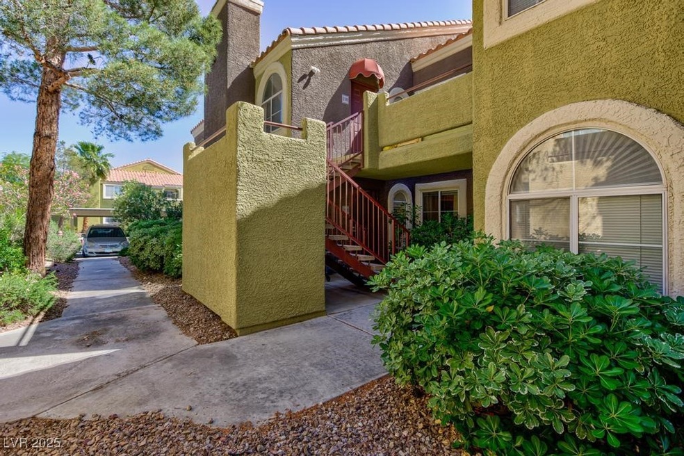 View of home's exterior featuring a tiled roof, st