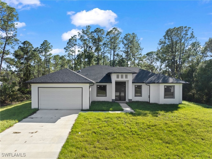 View of front of home featuring a garage and a fro