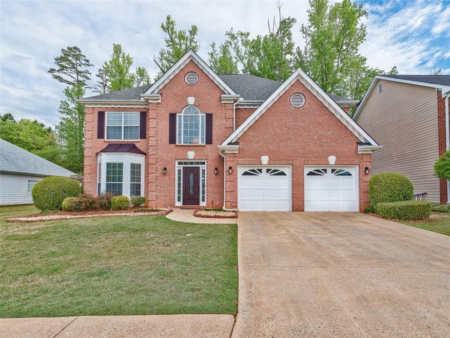 Brick beauty in the heart of popular Roswell! Minu