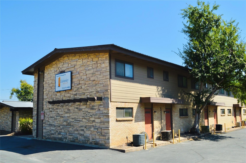 View of front of house featuring cooling unit, br