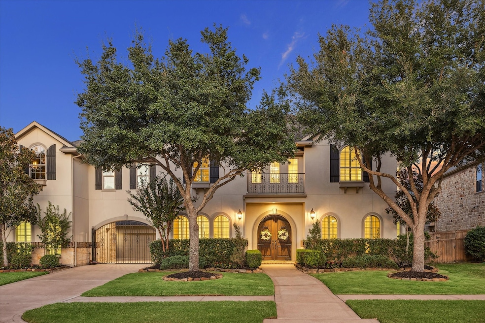 Gorgeous Mediterranean style home with luscious landscaping, mature trees, gated porte cochere, located in Cross Creek Ranch walking distance to Katy ISD schools.