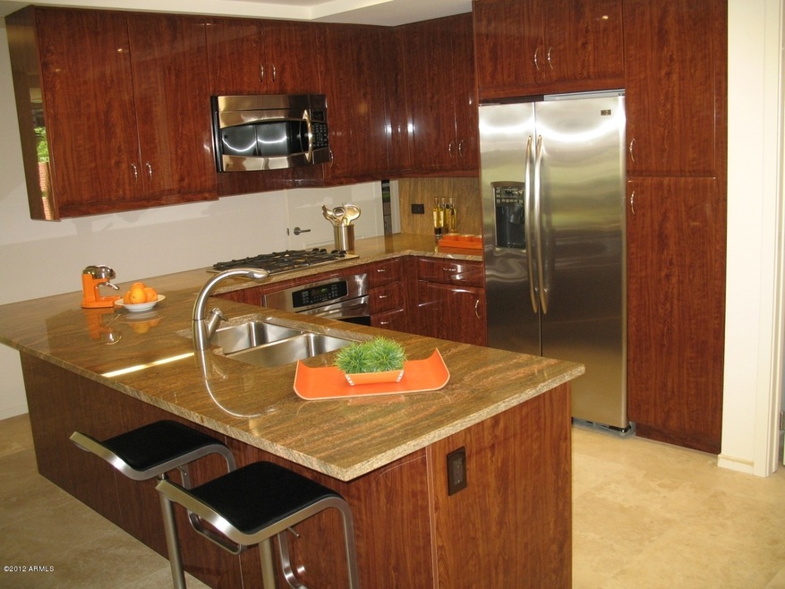 shiny cherry burl cabinetry with piano f