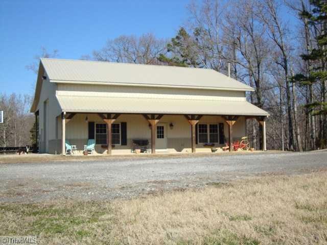 Exterior Front. Workshop with full covered front porch. Can be converted to residence.