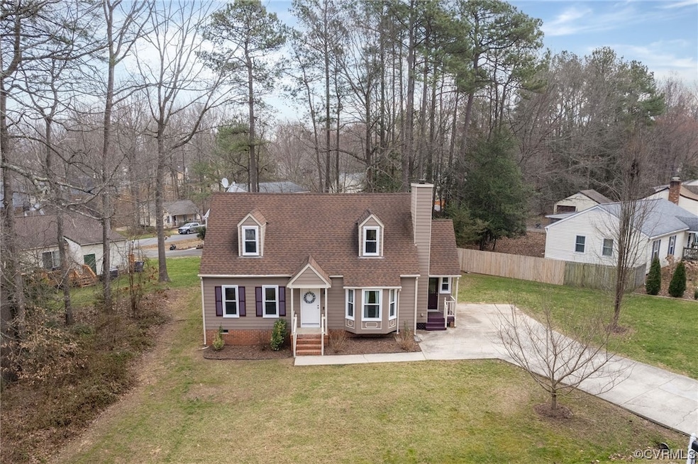 Cape cod-style house with a front lawn