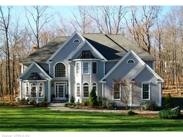 Exterior Front. Exquisite, private setting enhance