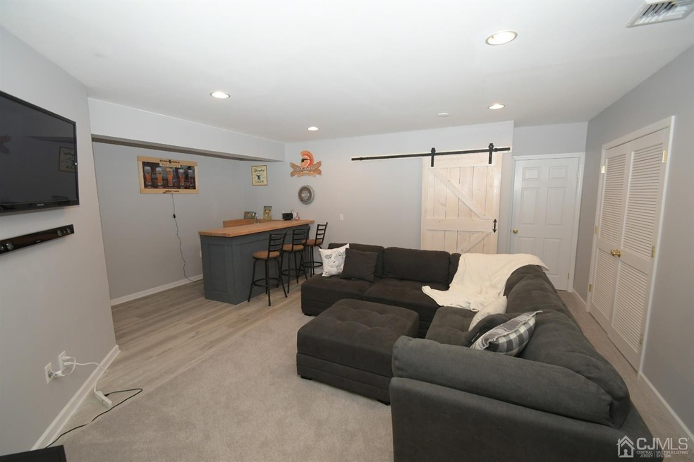 Main Room in basement with custom wet bar