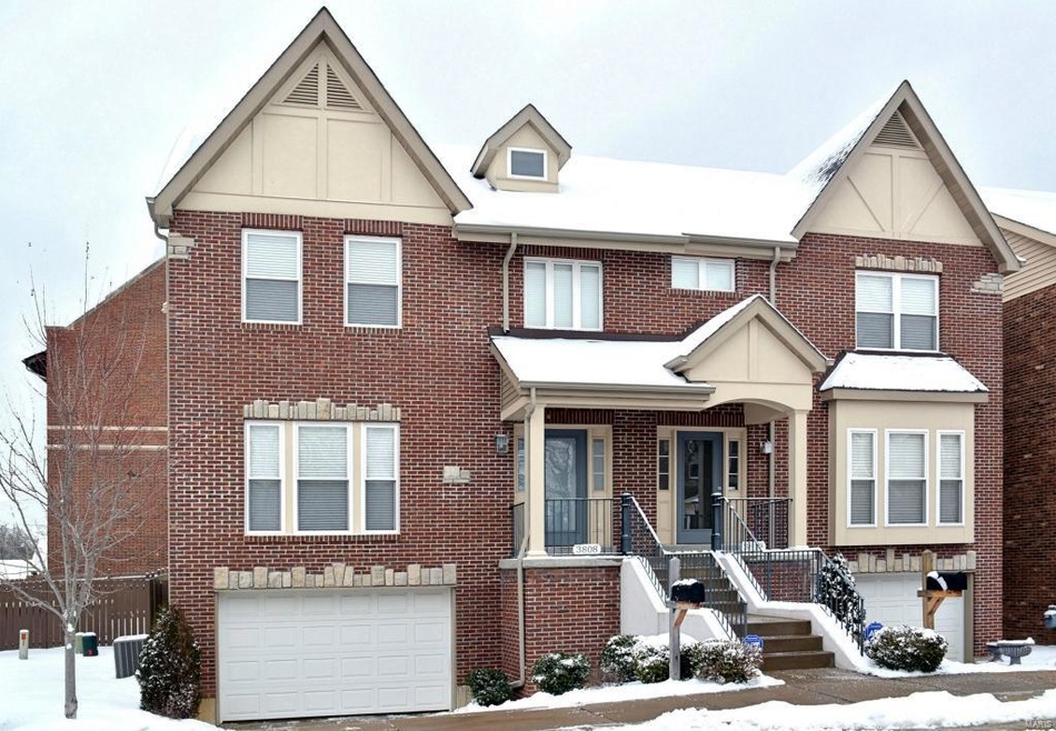 Designed to look like a classic St. Louis Hills style home. Notice the brick and stone accents? 3808 is the door on the left. By the way, the snow just stopped and the driveway and stairs have been cleared by the snow removal company. Now that's serv