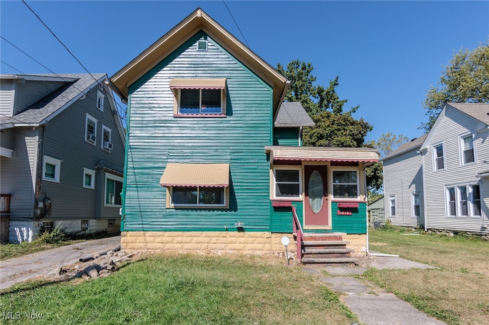 View of front of house with a front lawn