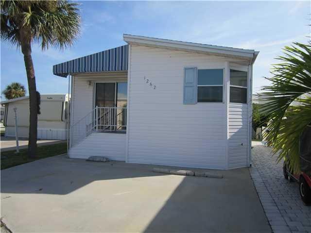 Exterior Front. A lovely home with 8 ft of grassy