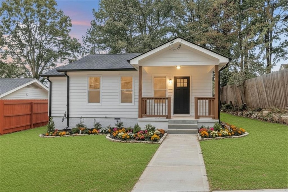 View of front of house with a porch and roof with shingles