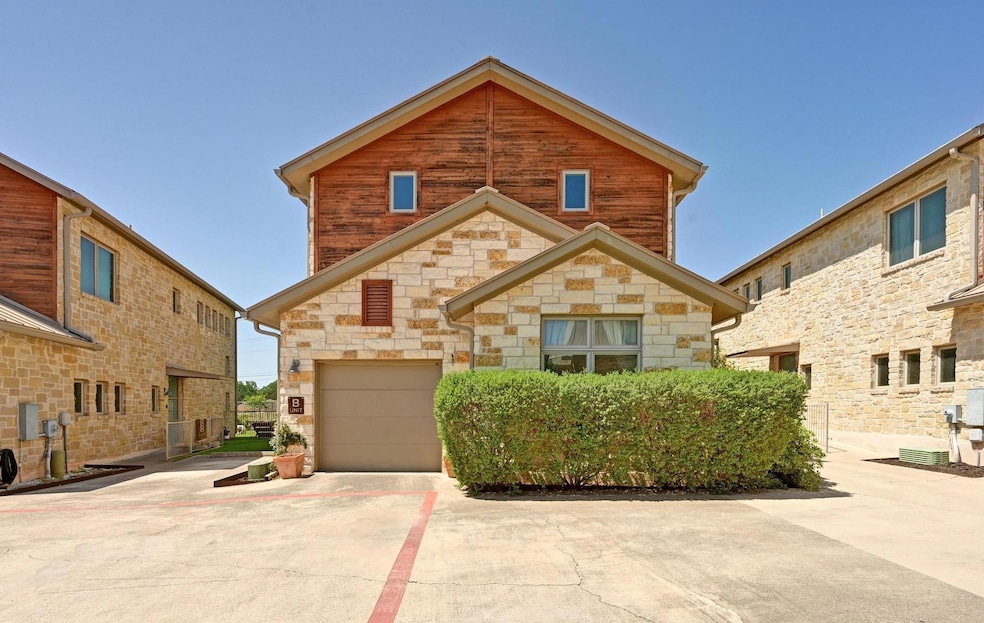 View of front of property featuring concrete driv
