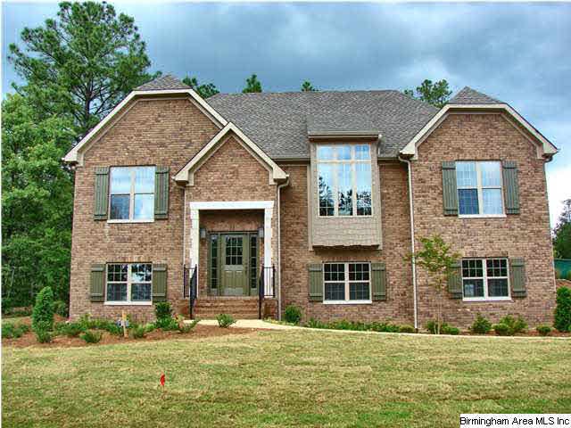 Split foyer plan with 3 sides brick, rear is hardiplank siding. Corner lot.