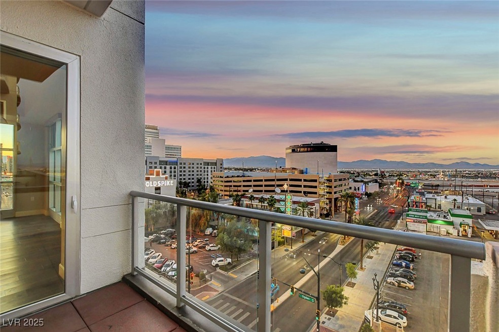Balcony with a view of city and a mountain view