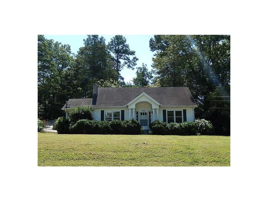 Exterior Front. Level corner lot with side entry g