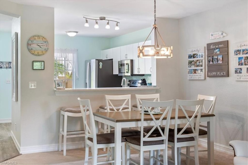 Dining space featuring a chandelier and light wood-style flooring