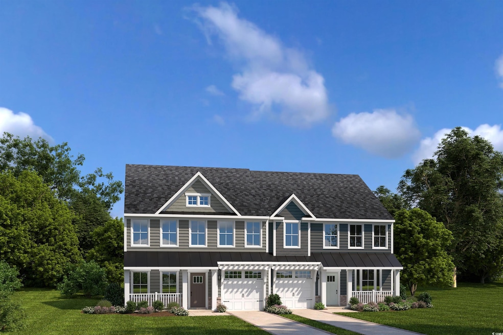 View of front of home with a porch, a standing seam roof, a shingled roof, and a front yard