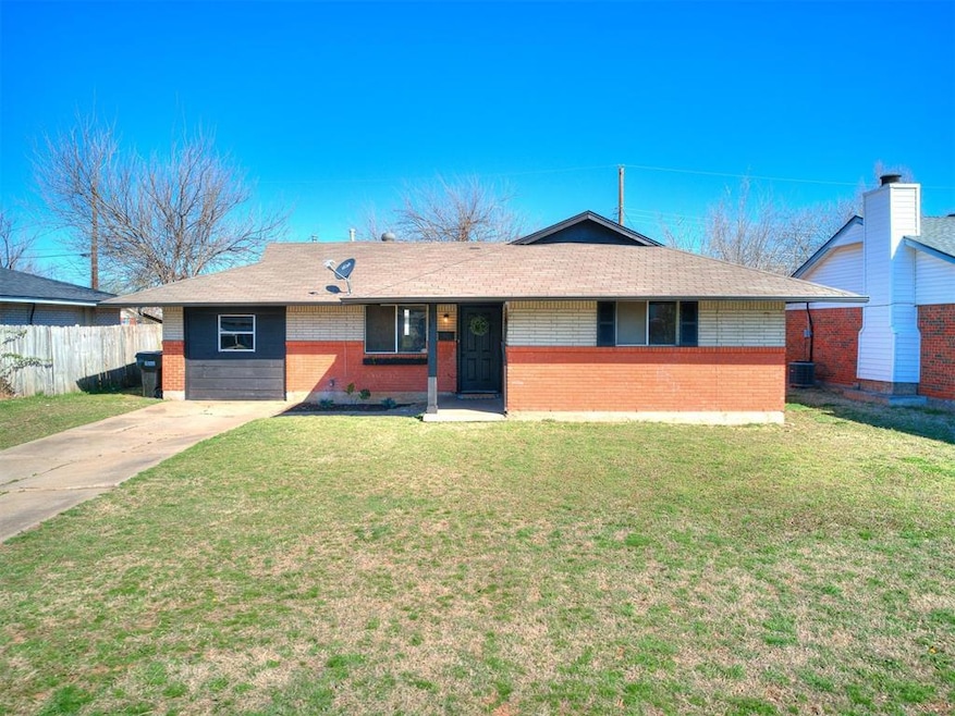 Ranch-style home featuring brick siding, a shingle