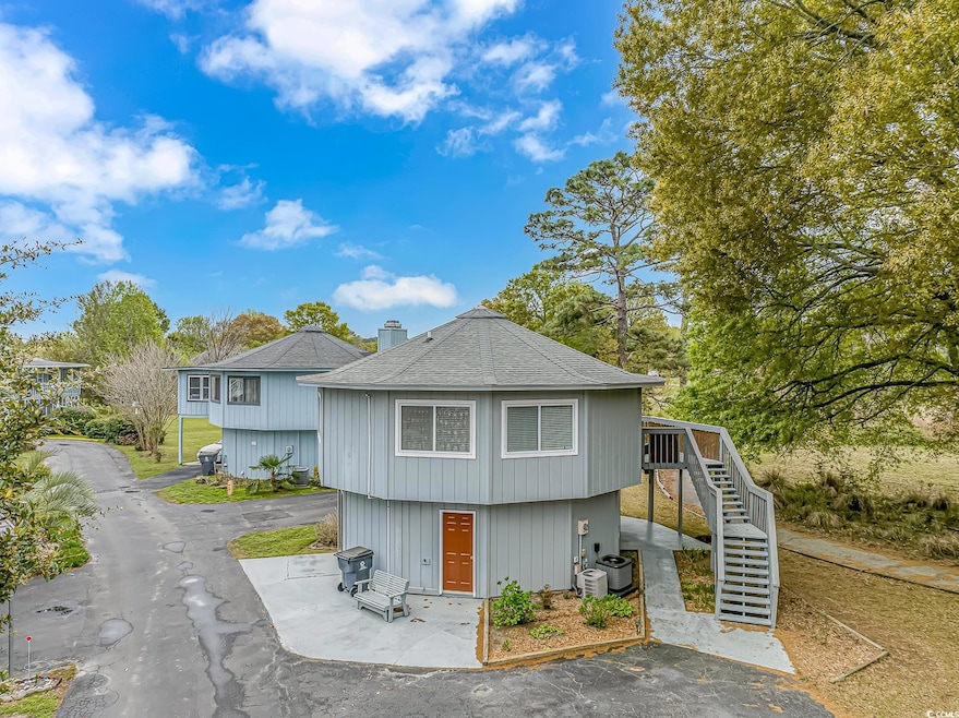 View of front of property with cooling unit, roof 