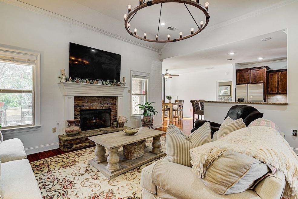 Living room with a fireplace, ornamental molding, 