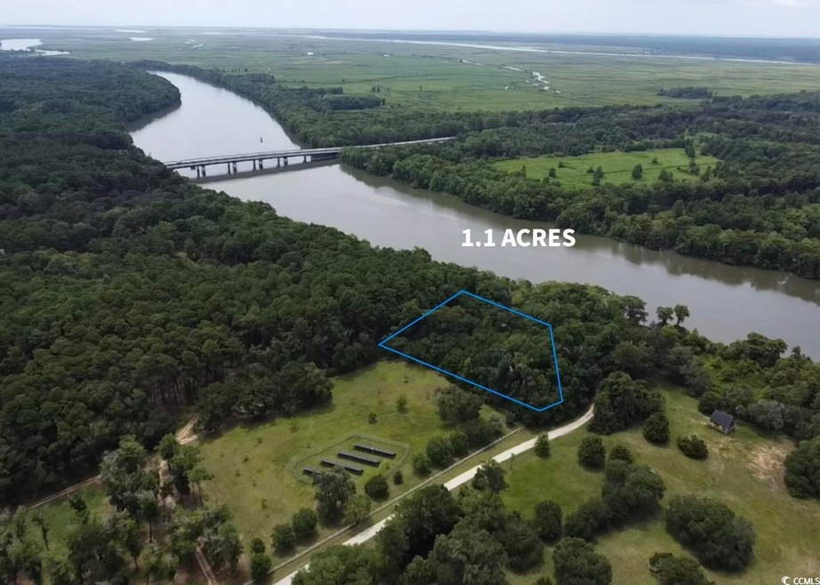 Aerial view featuring a water view and a rural vie
