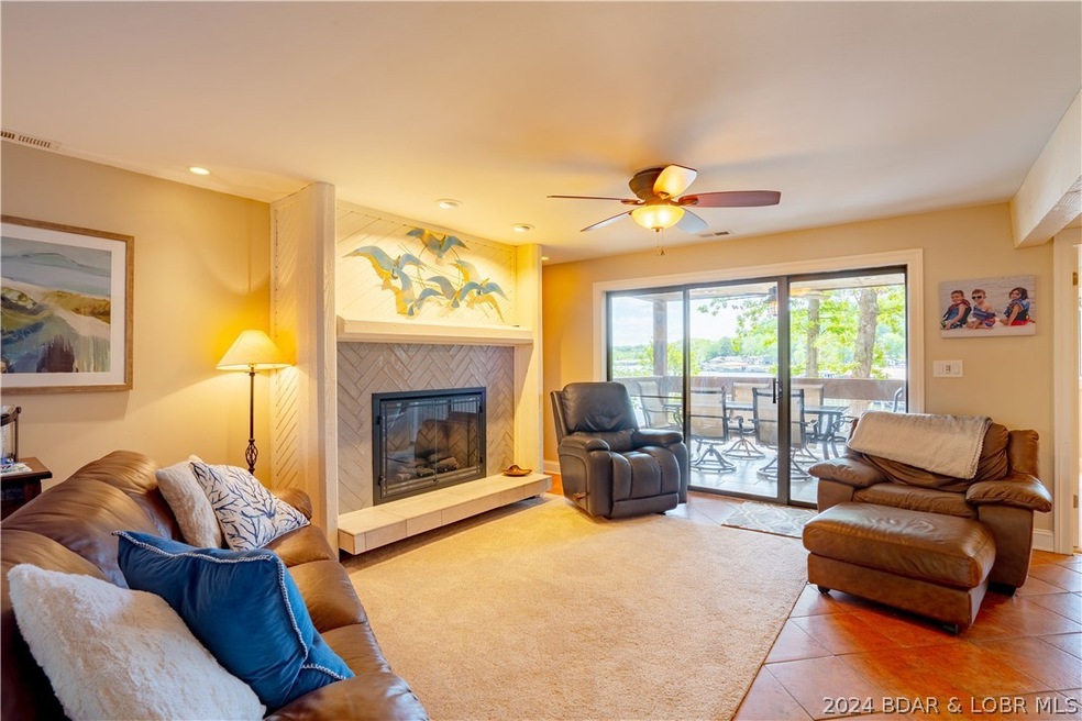 Spacious living room with carpet and tile