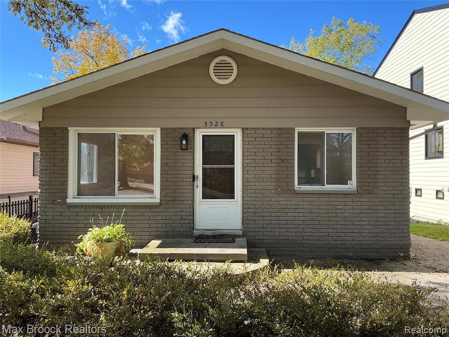 View of front of house with brick siding
