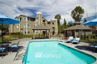 One of the private swimming pools with hot tub in back