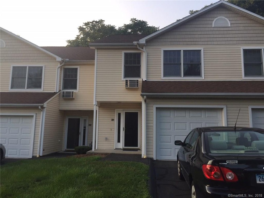 Exterior with 1 attached garage and 2 parking spac