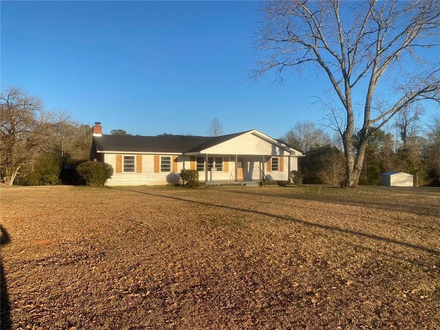 Single story home with a front lawn