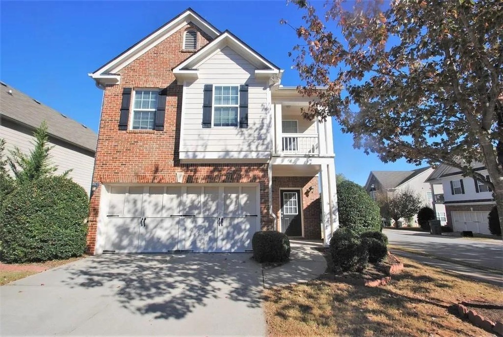 View of front of property featuring a garage