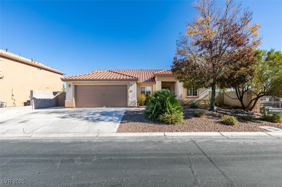 View of front of home featuring stucco siding, a g