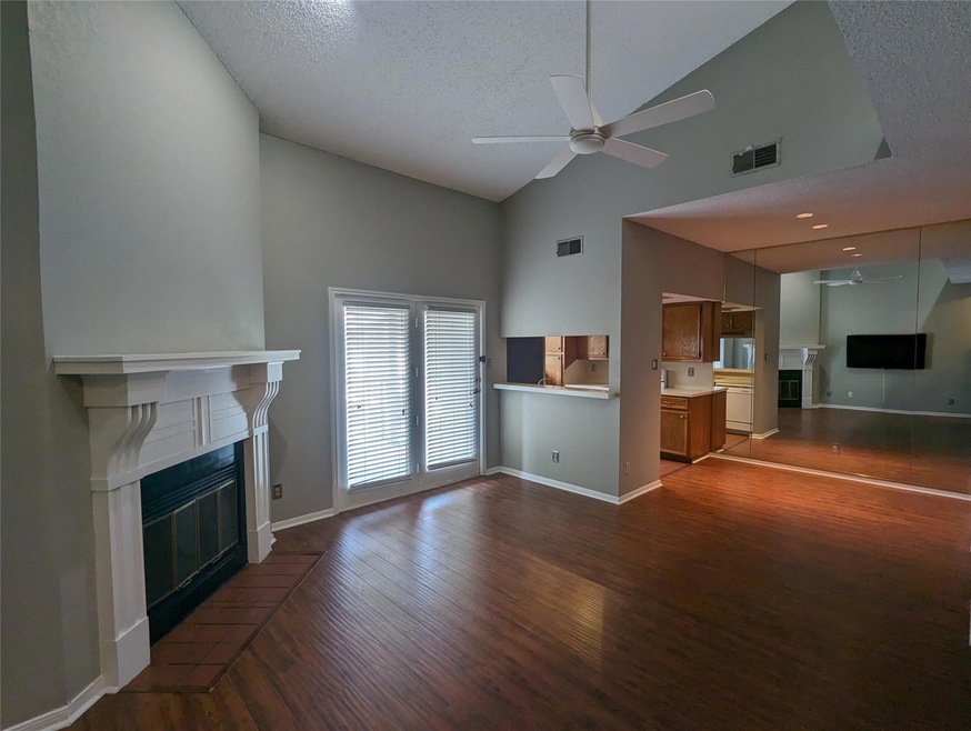 Unfurnished living room with a glass covered fire