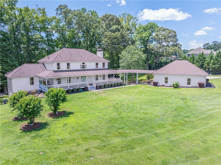 Rear view of house featuring a lawn