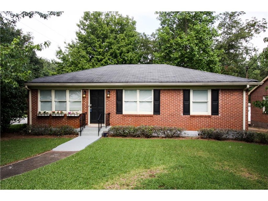 EXTERIOR VIEW - FRONT OF 4-SIDED BRICK PROPERTY LO