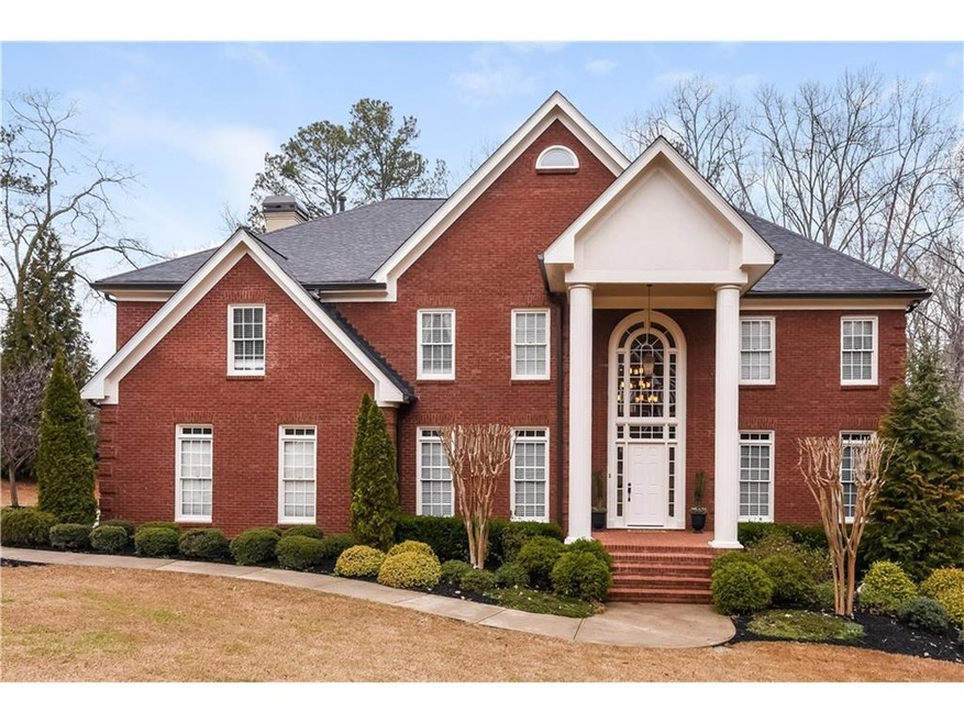 Beautiful 4-sided brick home with professional lan