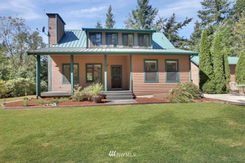 Welcome home to this 4 bedroom, 2 bath home perfectly appointed on 5+ acres of extreme privacy!
