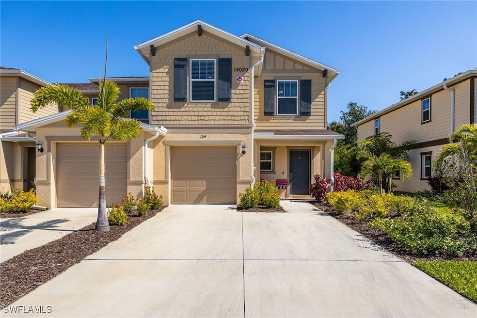 View of front of house with driveway and one car g