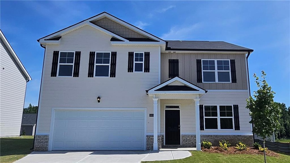 Craftsman-style home featuring a garage and a fron