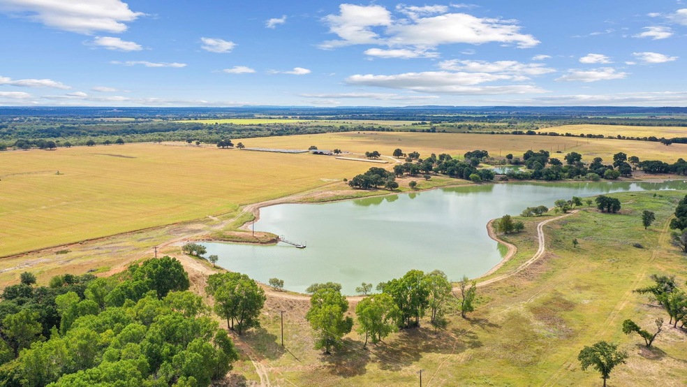 Bird's eye view featuring a water view and a rural