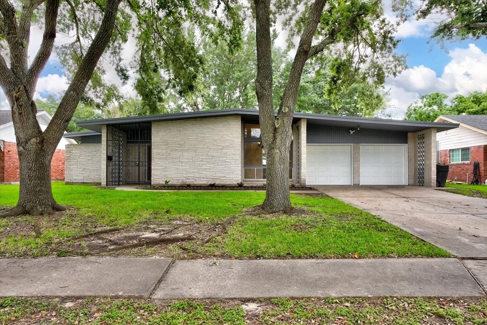 Fabulous updated home in Sharpstown Country Club Terrace.  Wonderful large lot with mature trees.  Double wide driveway with two car garage and plenty of additional parking.  Inside the garage is plenty of room for additional home items and also includes a separate storage room that can be used to house lawn equipment, bikes, or be turned into a mud room.  Lots of possibilities.