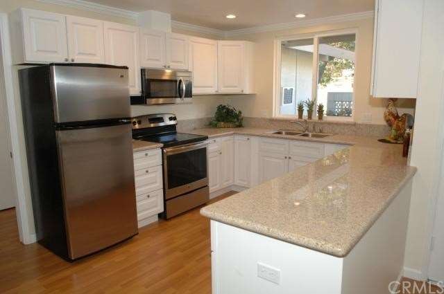 Brand new kitchen with gleaming granite counters, 