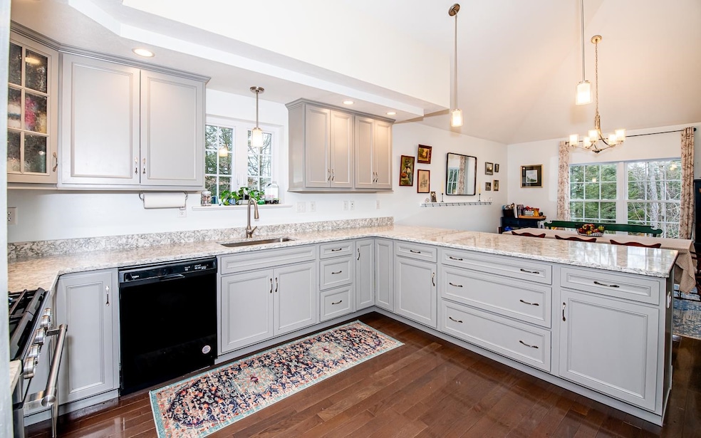Beautiful Kitchen with vaulted ceilings and skylig
